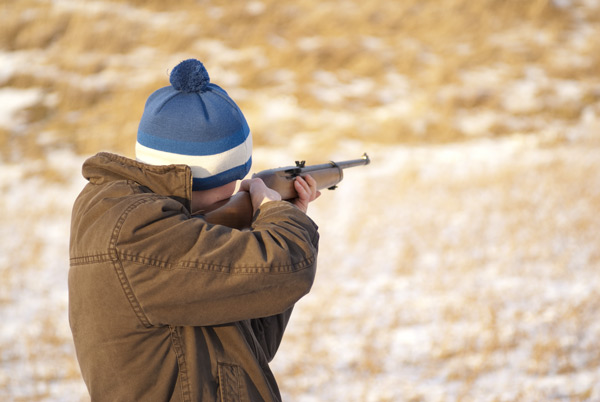 Photo of Joe Estes playing rifle cricket